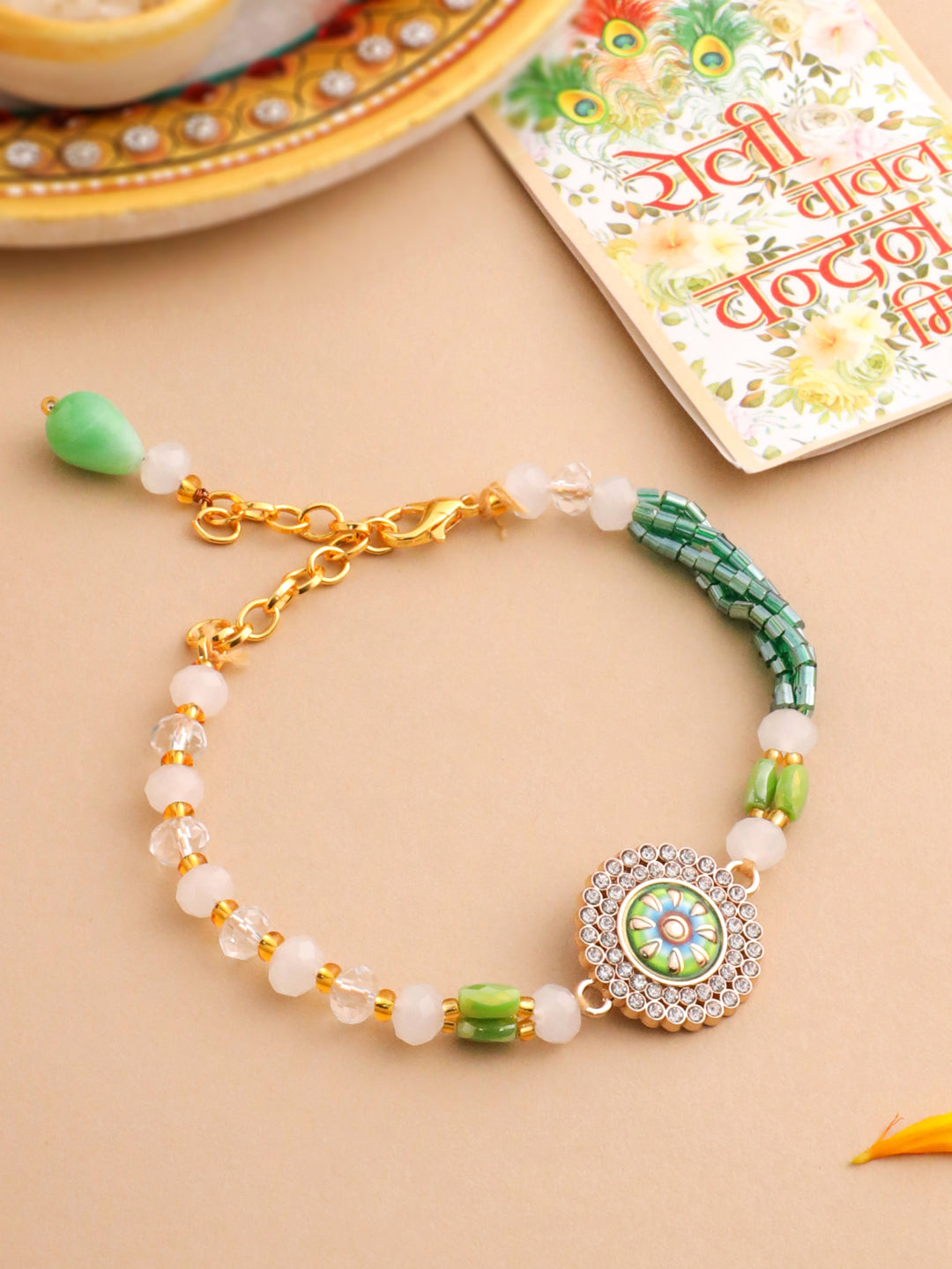 NVR Women Green Artificial Stones & Beads Floral Wraparound Rakhi with Roli Chawal Chandan & Mishri | Swadesiicart