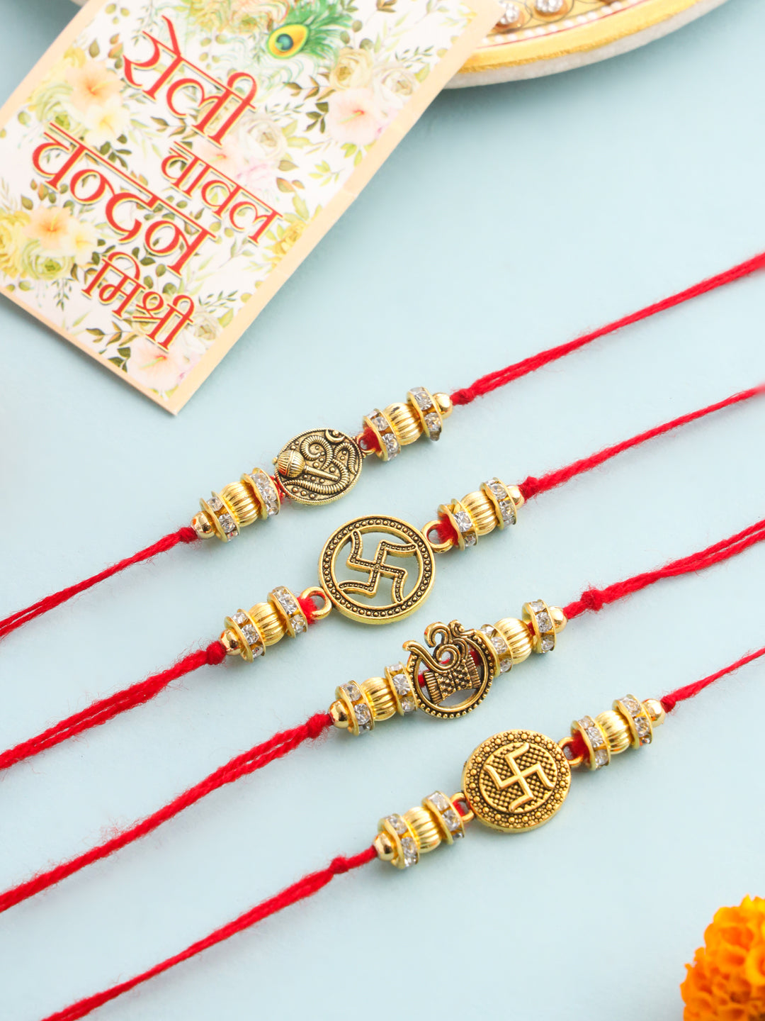 NVR Men Set of 4 Gold Toned Artificial Stones Swastik Design Thread Rakhi with Roli Chawal Chandan & Mishri - Swadesiicart