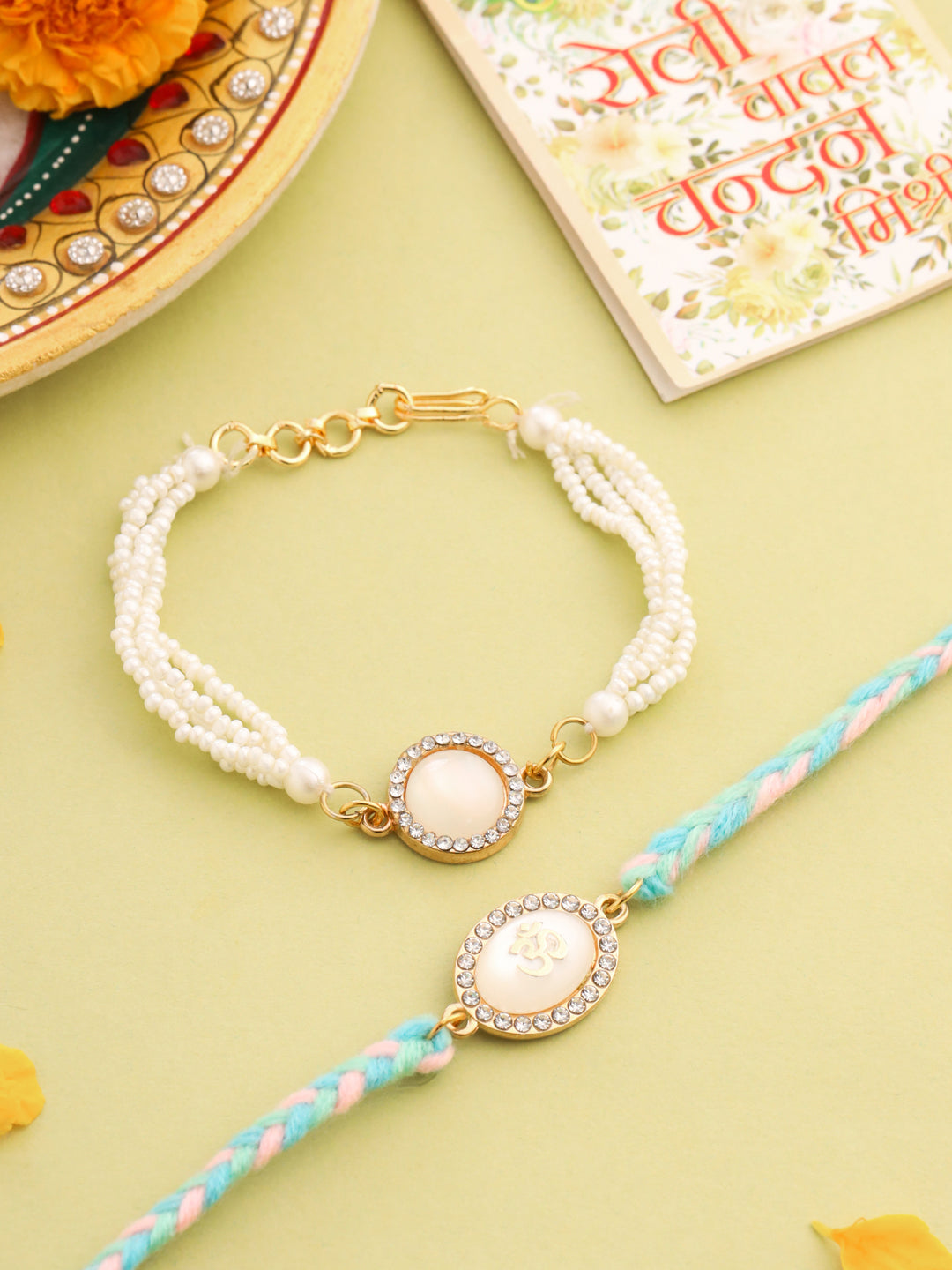 NVR Set of 2 White Pearls & Artificial Beads Bhaiya Bhabhi Rakhi with Roli Chawal Chandan & Mishri - Swadesiicart