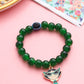 NVR Kids Cartoon Design Green Artificial Beads Thread Rakhi with Roli Chawal Chandan & Mishri | Swadesiicart