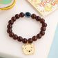 NVR Kids Cartoon Design Brown Artificial Beads Thread Rakhi with Roli Chawal Chandan & Mishri | Swadesiicart