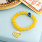 NVR Kids Cartoon Design Yellow Artificial Beads Thread Rakhi with Roli Chawal Chandan & Mishri | Swadesiicart