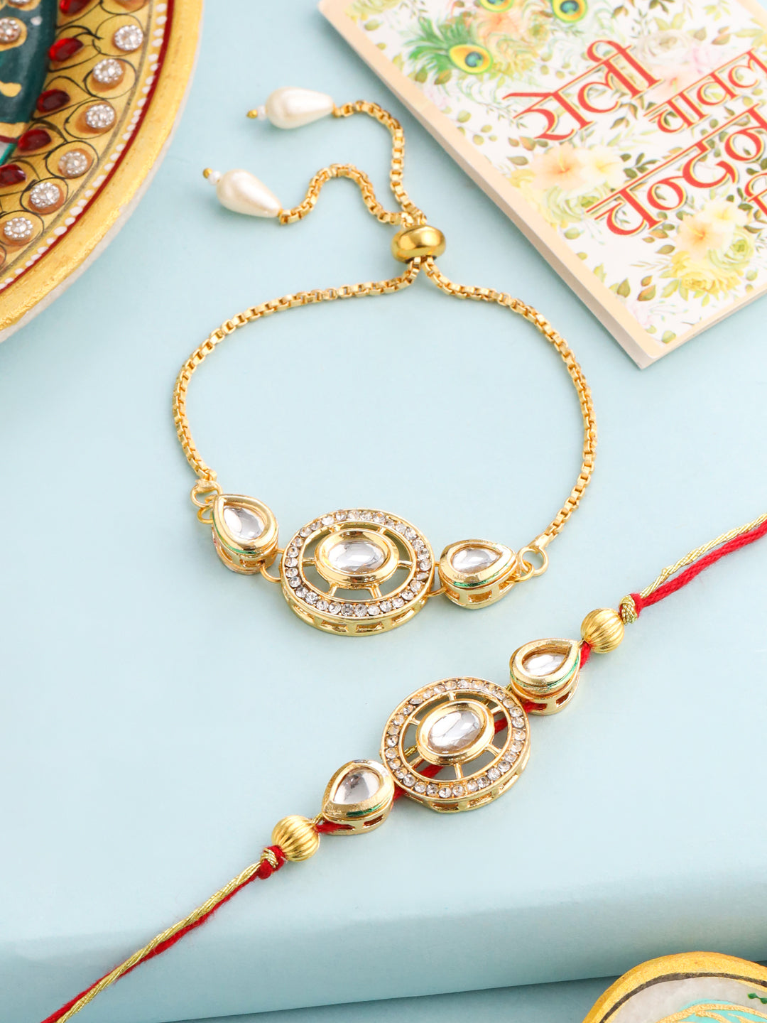 NVR Set of 2 Gold Toned Kundan Studded Bhaiya Bhabhi Rakhi with Roli Chawal Chandan & Mishri | Swadesiicart
