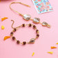 NVR Set of 2 Gold Toned Rudraksh & Pearls Bhaiya Bhabhi Rakhi with Roli Chawal Chandan & Mishri | Swadesiicart