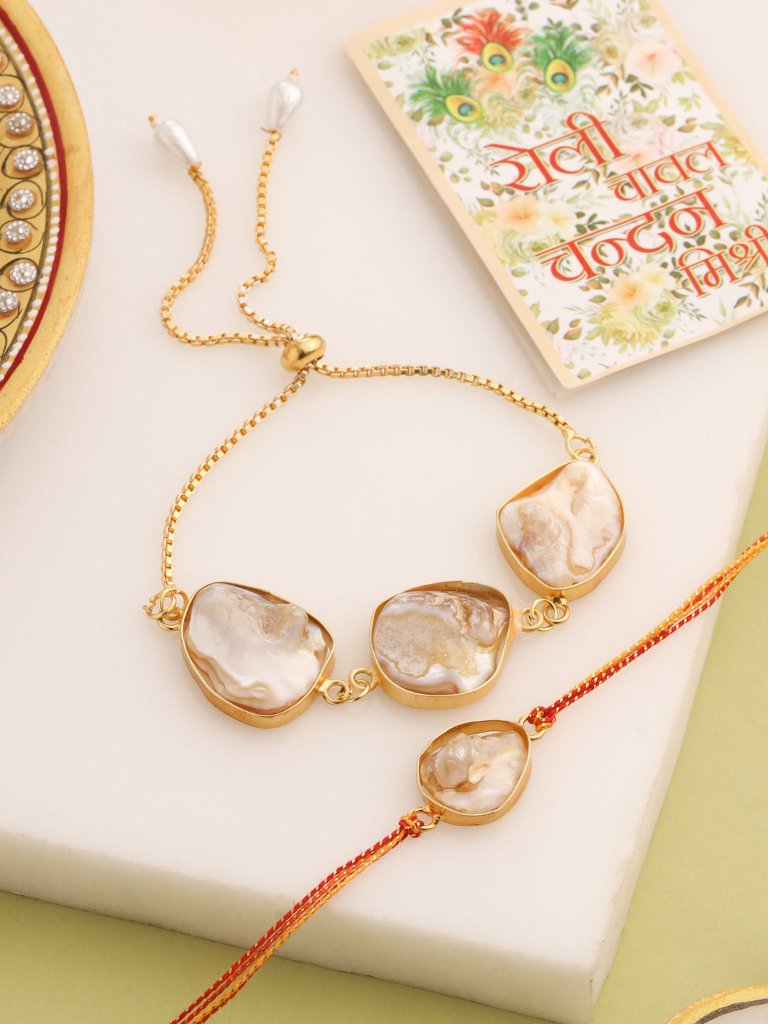 NVR Set of 2 Gold Toned Pearls Bhaiya Bhabhi Rakhi with Roli Chawal Chandan & Mishri - Swadesiicart