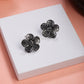 NVR Women Silver Plated Oxidized Floral Shape Stud Earrings - Swadesiicart