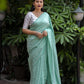 Green Poly Georgette Woven Design Saree with Unstitched Blouse - Hiral Fashion | Swadesiicart