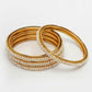 NVR Women's Set of 4 Gold-Polished Pearl Handcrafted Traditional Bangles - Swadesiicart