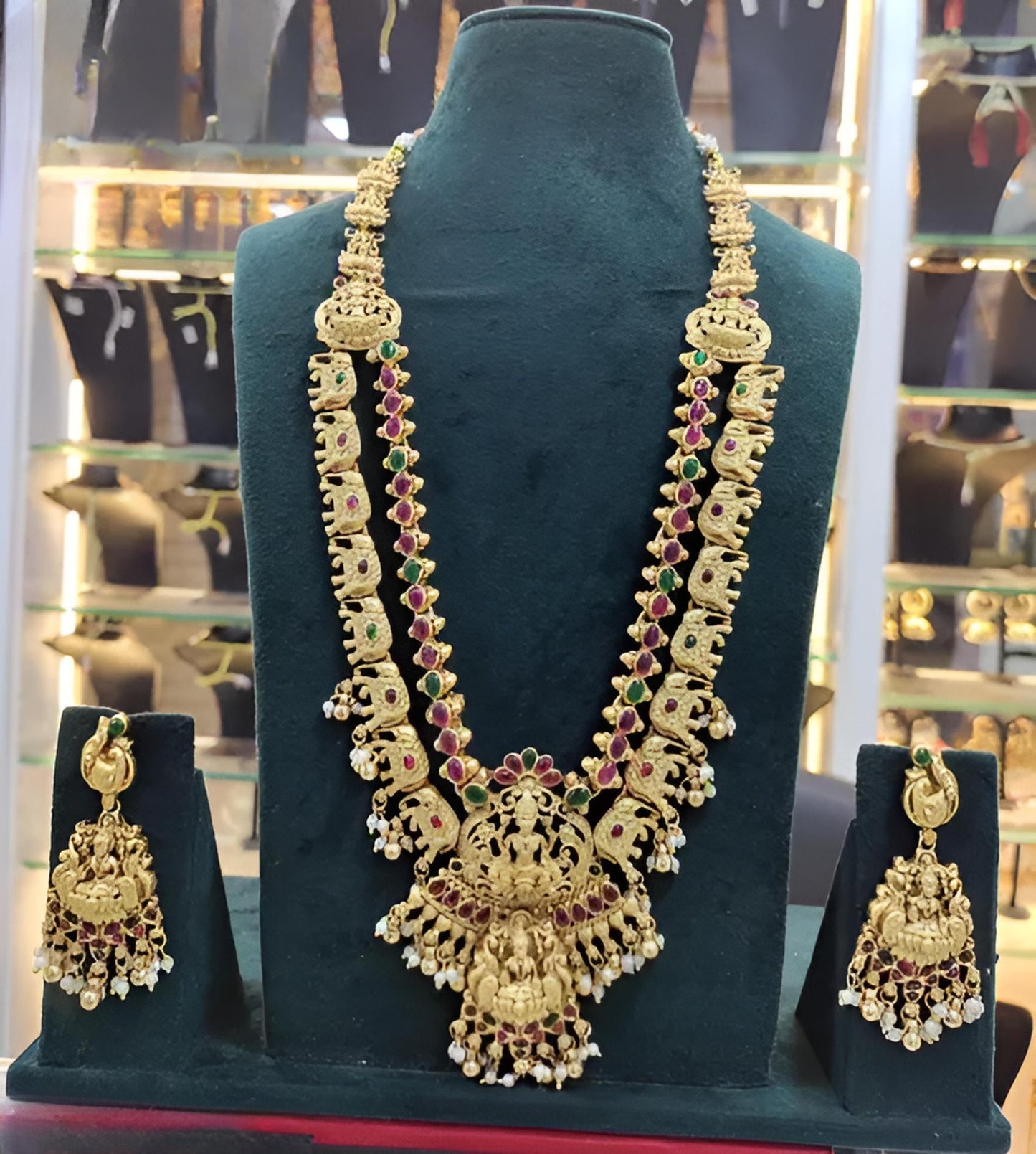 Jewel City Exquisite Gold-Plated Bridal Necklace and Earrings Set with Ruby and Emerald Accents | Swadesiicart