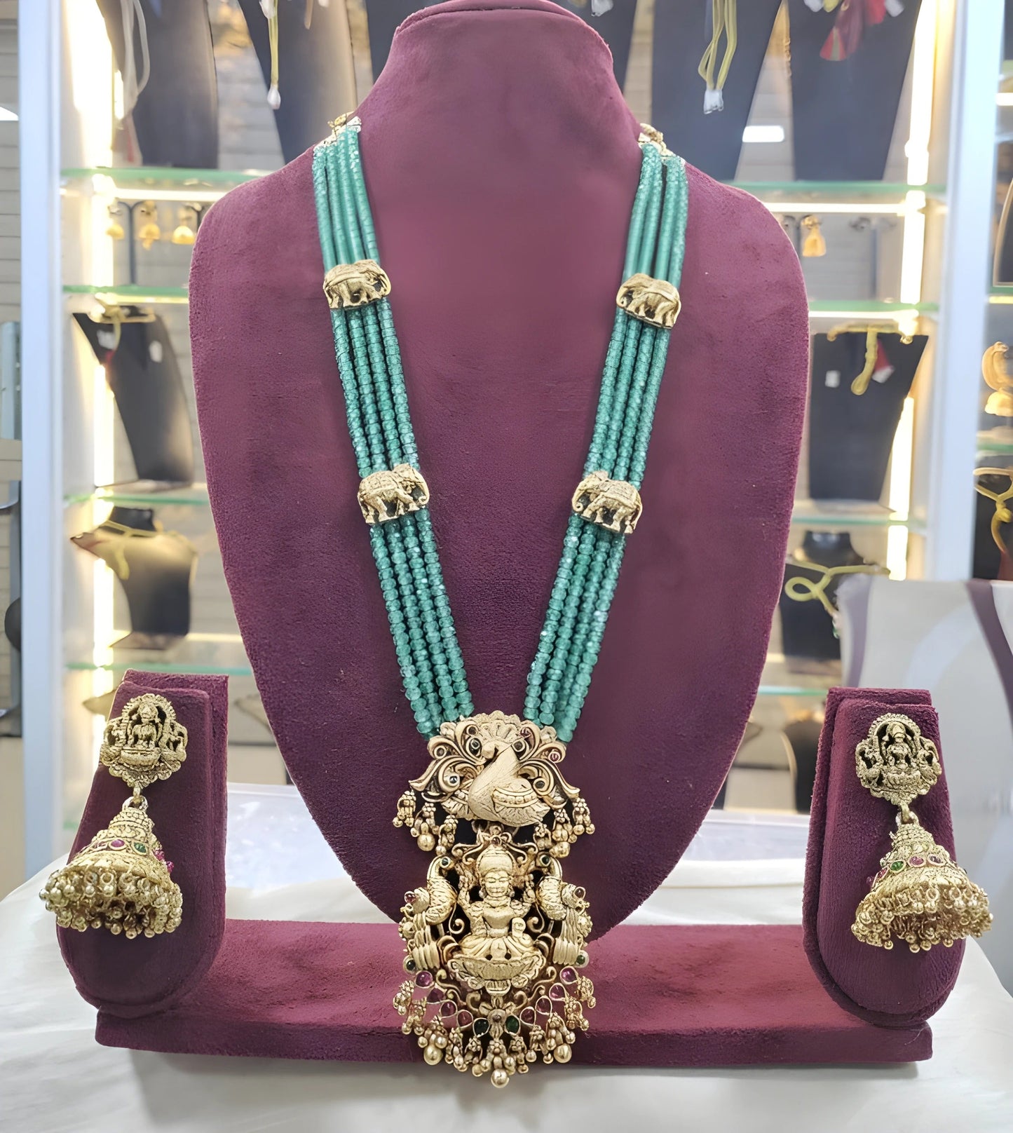 Jewel City Luxurious Emerald Green Temple Goddess Kundan Jewelry Set - Handcrafted Gold-Plated Bridal Necklace with Jhumka Earrings | Swadesiicart