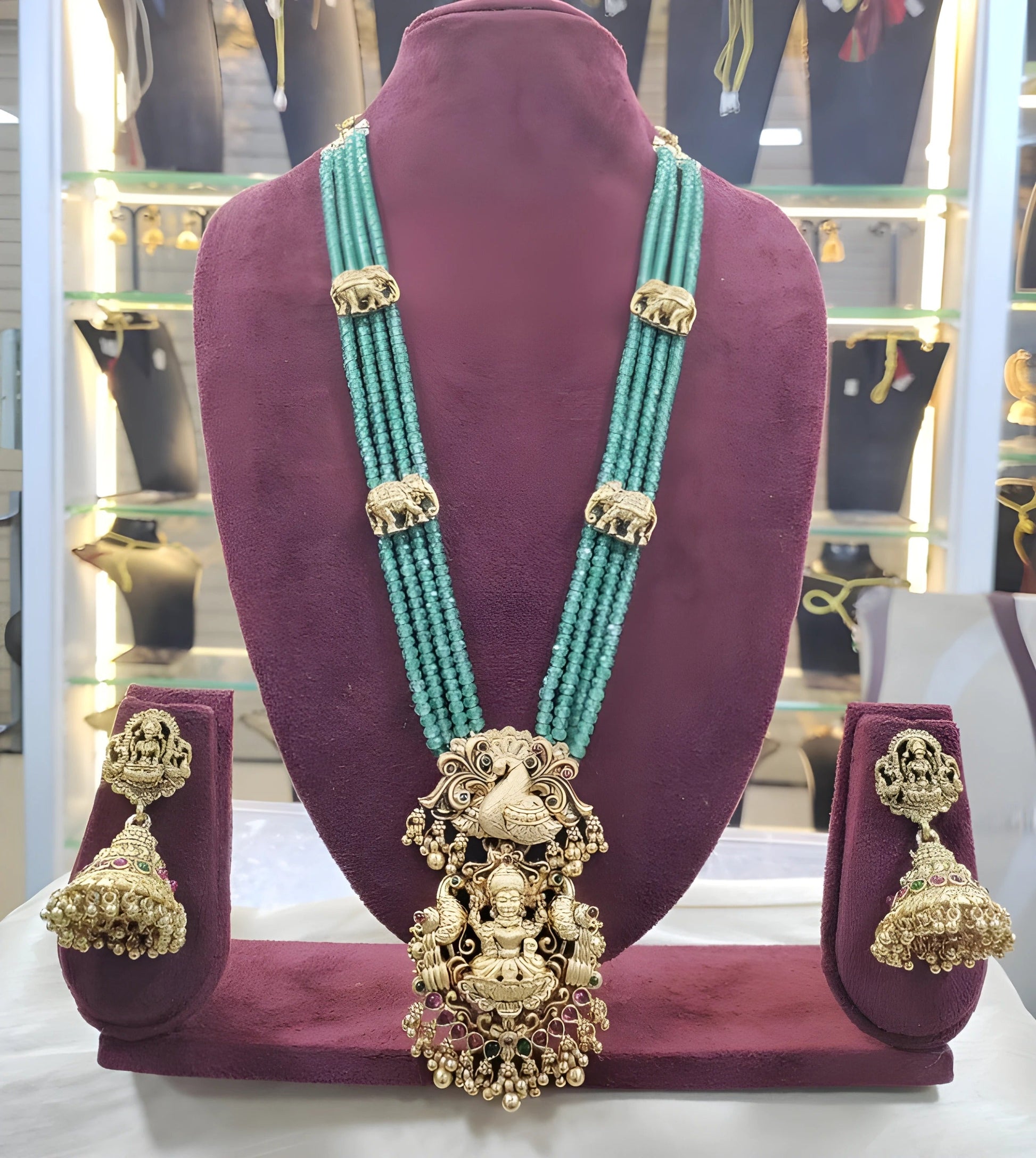 Jewel City Luxurious Emerald Green Temple Goddess Kundan Jewelry Set - Handcrafted Gold-Plated Bridal Necklace with Jhumka Earrings | Swadesiicart