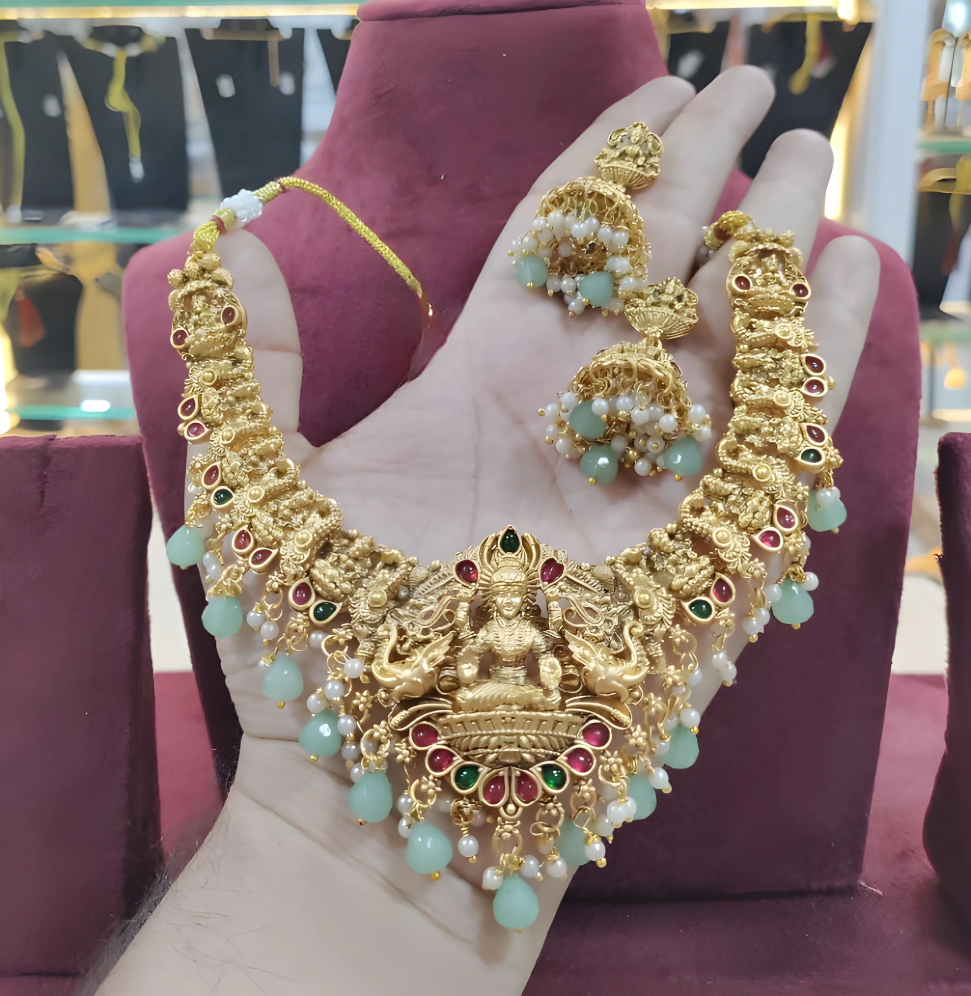 Jewel City Opulent Gold Peacock Lakshmi Temple Necklace Set - Handcrafted Antique Finish Bridal Jewelry with Emerald & Pearl Accent | Swadesiicart