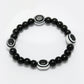NVR Women & Men Black Evil Eye Elasticated Rakhi With Roli Chawal - Swadesiicart