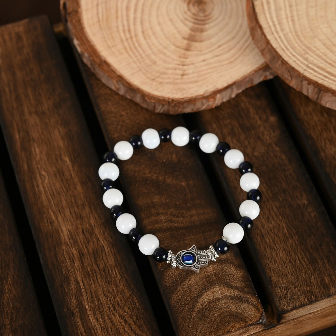 NVR Women & Men Black & White Evil Eye Elasticated Rakhi With Roli Chawal - Swadesiicart