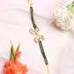 Black Gold-Toned Kundan Bracelet Mangalsutra - Ruby Raang