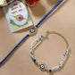 NVR Women & Men Set of 2 Blue Evil Eye Bhaiya Bhabhi Rakhi Set With Roli Chawal & Chocolate | Swadesiicart