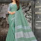 Shree Shyam Fashion Elegant Sea Green Woven Linen Saree with Contrast Zari Border & Tassels - Soft & Breathable Party Wear