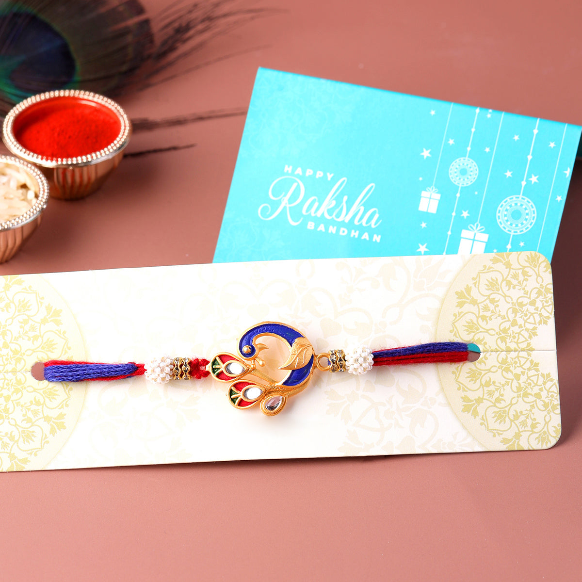 trueBrowns X Voylla Designer Enameled Peacock Rakhi With Roli Chaawal Pack | Swadesiicart