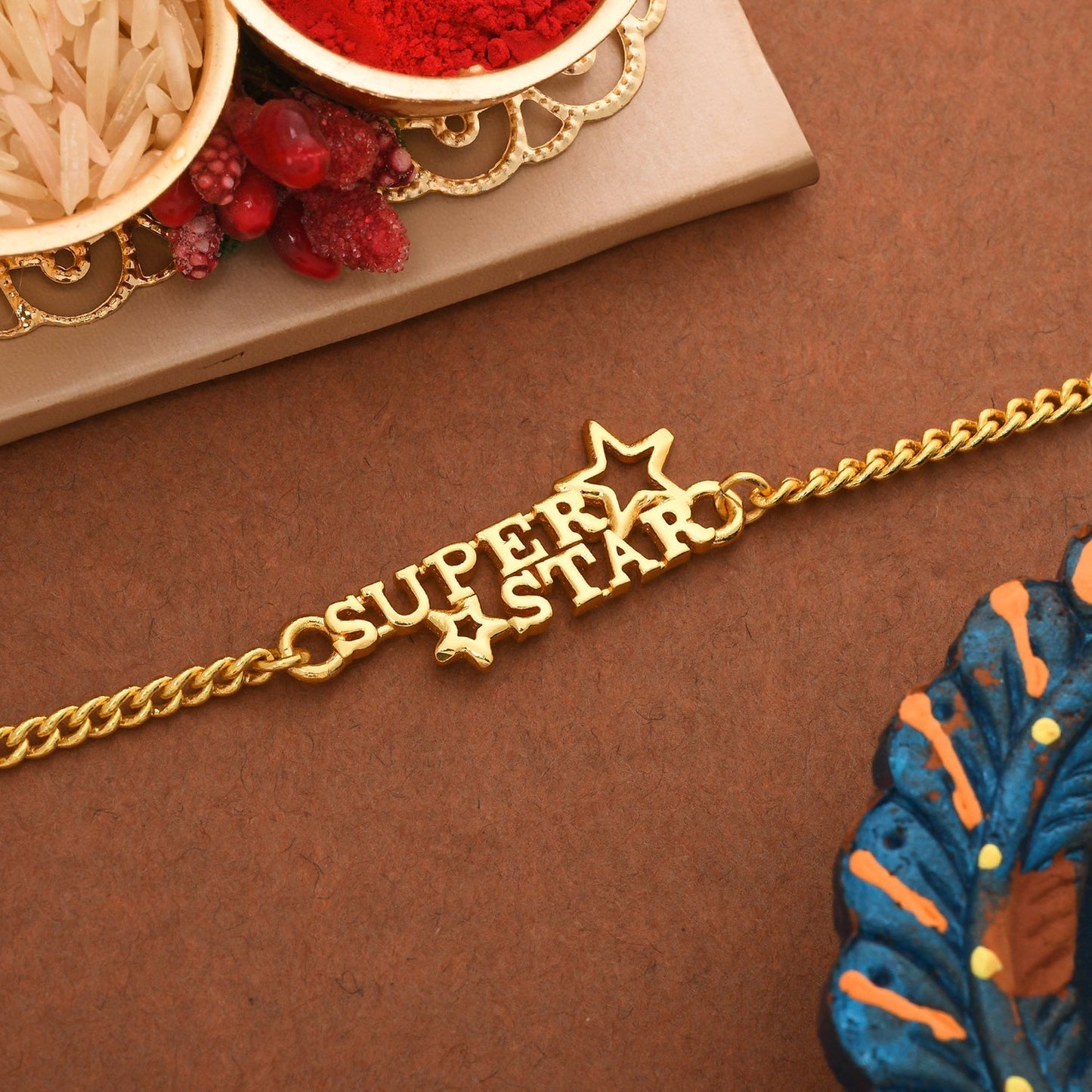trueBrowns X Voylla Super Star Gold Tone Bracelet Style Rakhi | Swadesiicart