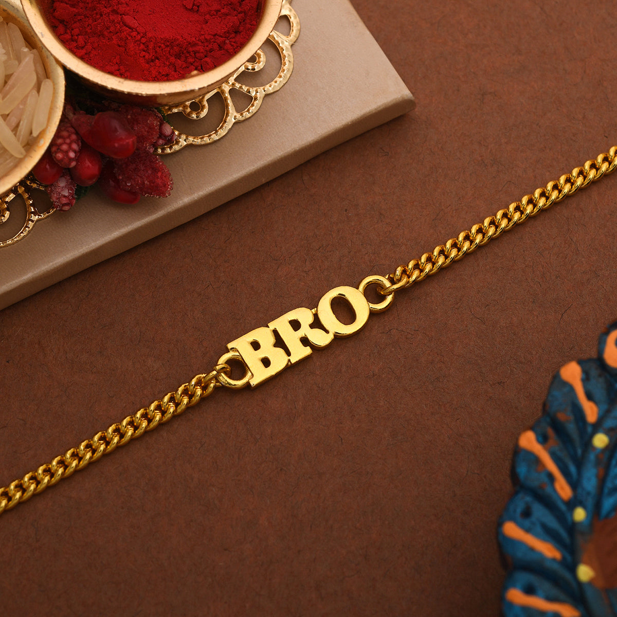 trueBrowns Gold Tone Fashionable BRO Rakhi | Swadesiicart