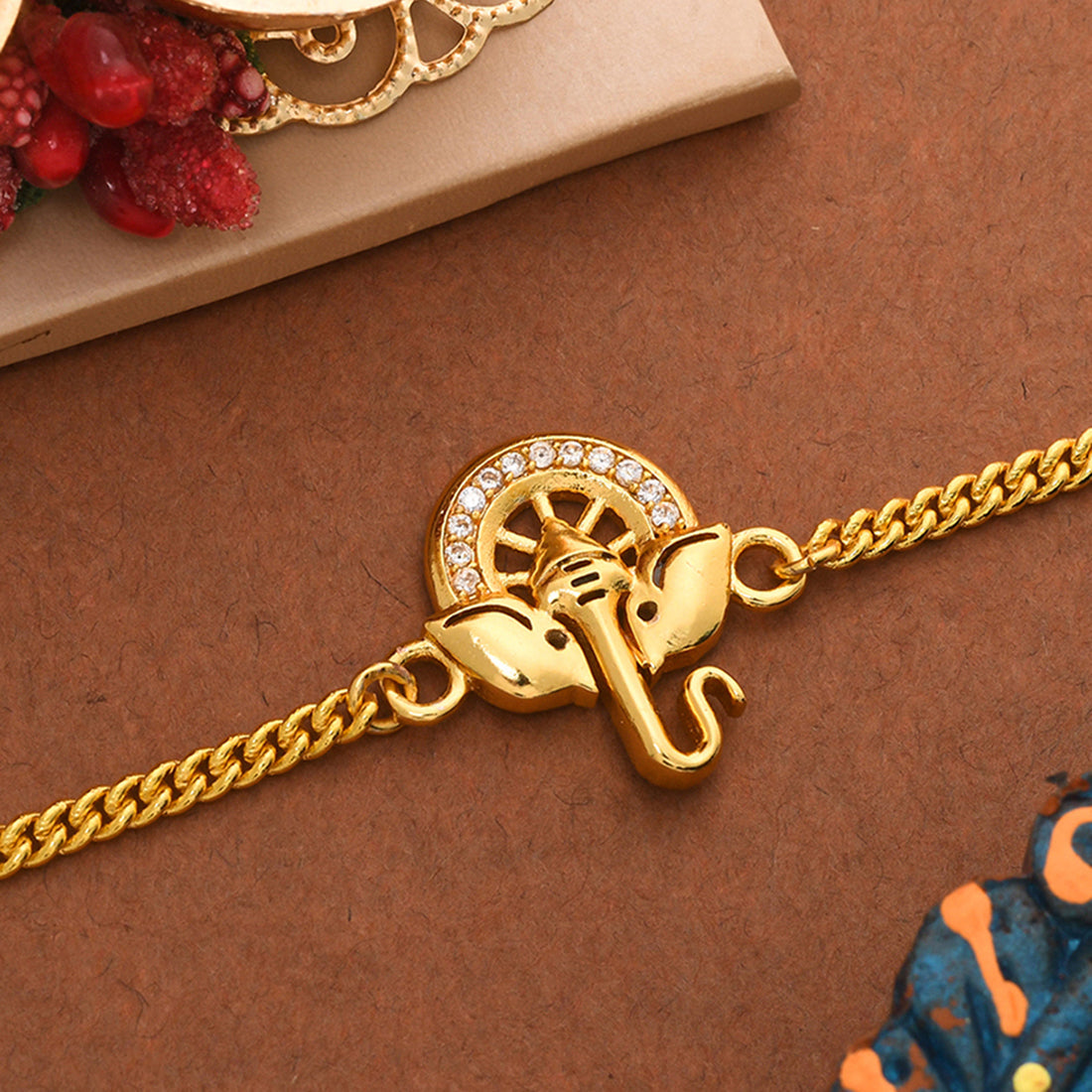 trueBrowns Gold Tone Ganesha Bracelet Style Rakhi | Swadesiicart