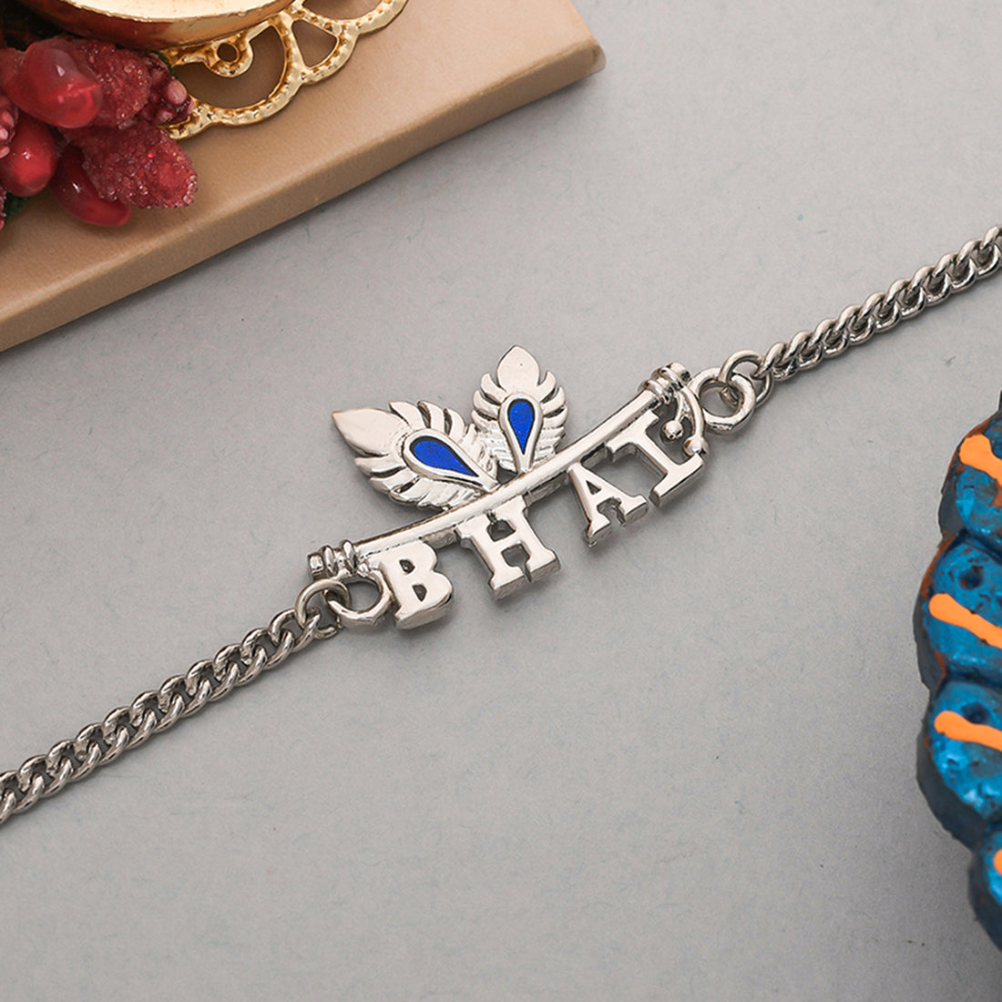 trueBrowns Peacock Feather Motif Silver Plated Bhai Bracelet Rakhi | Swadesiicart