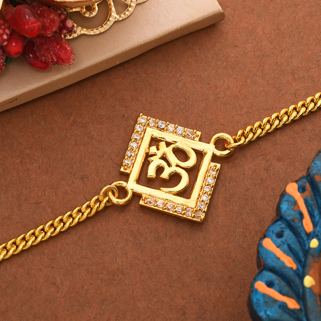 trueBrowns Gold Tone Auspicious OM Bracelet Rakhi | Swadesiicart