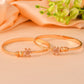 VOJ Set Of 2 Gold Polished Pink Stone Studded Floral Shaped Bangles - Swadesiicart