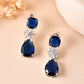 VOJ Silver Plated Blue Stone Studded Floral Shaped Studs Earrings - Swadesiicart