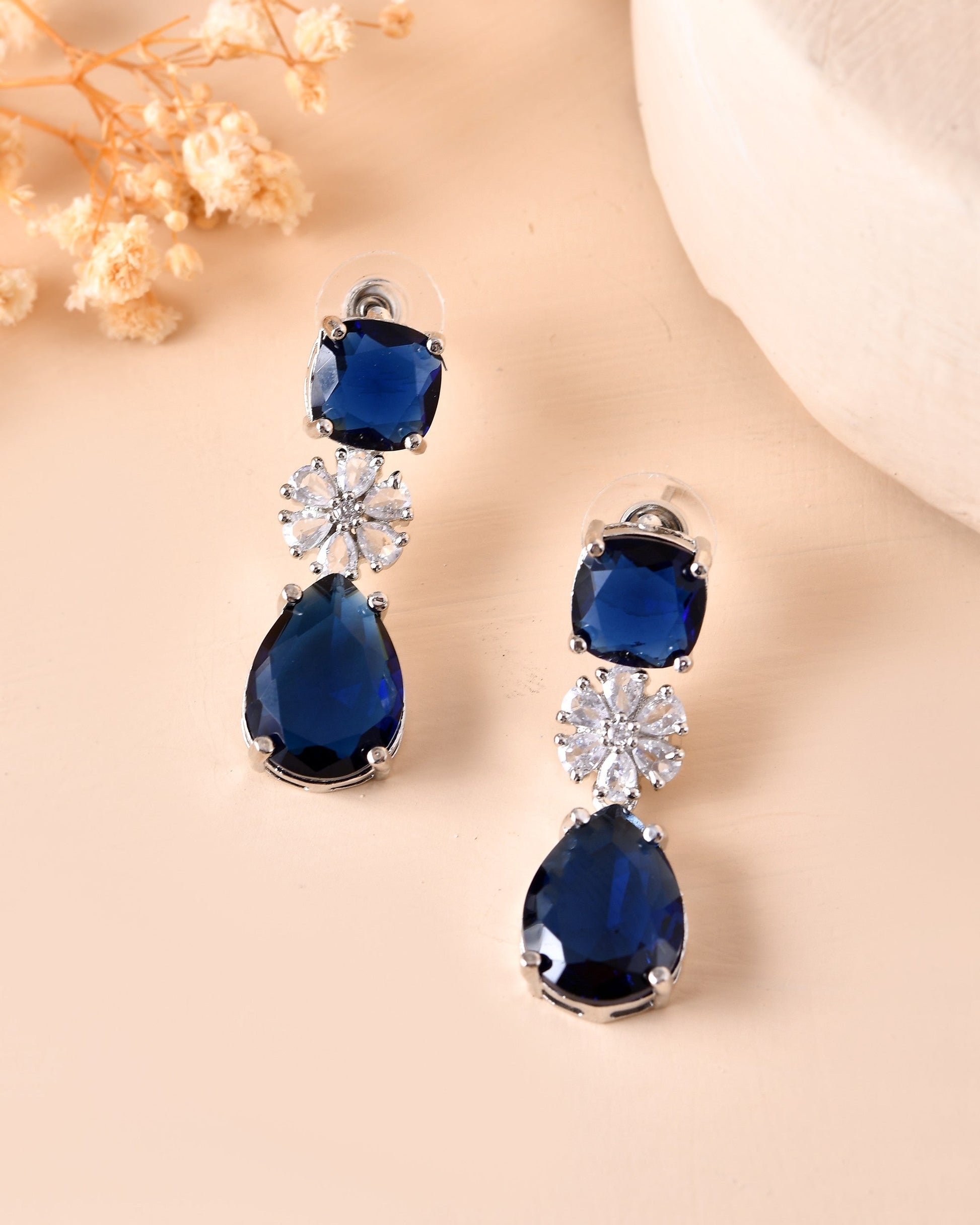 VOJ Silver Plated Blue Stone Studded Floral Shaped Studs Earrings - Swadesiicart