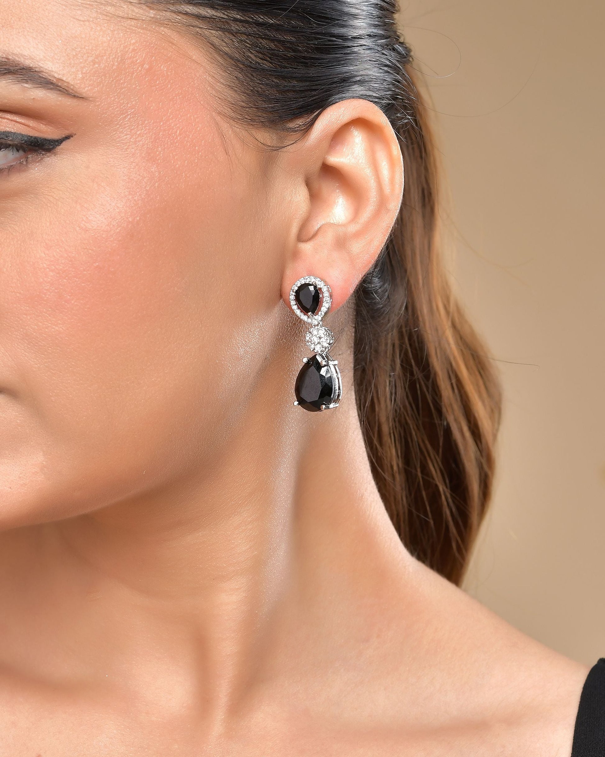 VOJ Silver Plated Black Stone Studded Floral Shaped Studs Earrings - Swadesiicart