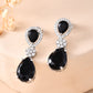 VOJ Silver Plated Black Stone Studded Floral Shaped Studs Earrings - Swadesiicart