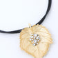 VOJ Leaf Shaped Gold Pandent With Black Necklace | Swadesiicart