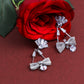 VOJ Silver Plated Stone Studded With Bow Triangle Shaped Earrings - VOJ (Valley Of Jewellery)