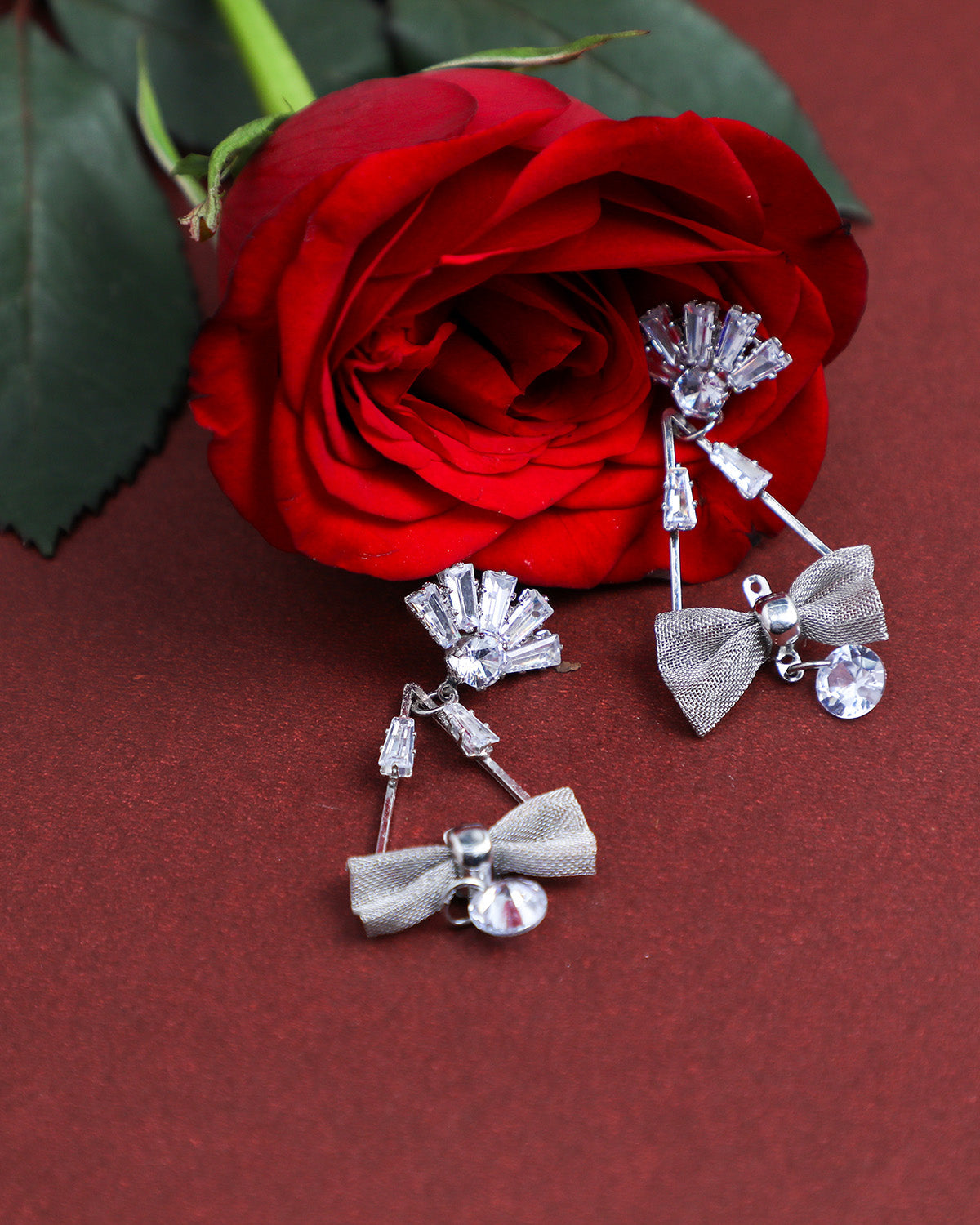 VOJ Silver Plated Stone Studded With Bow Triangle Shaped Earrings - VOJ (Valley Of Jewellery)