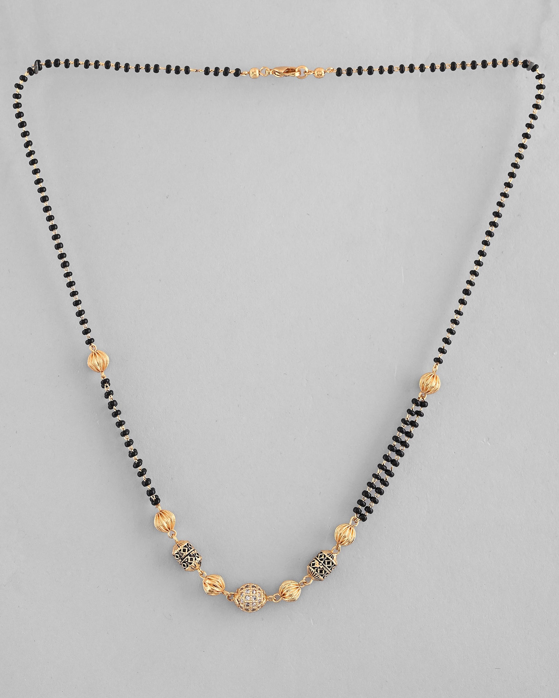 VOJ Gold-Polished Stone Studded Cricular shaped Mangalsutra - Swadesiicart