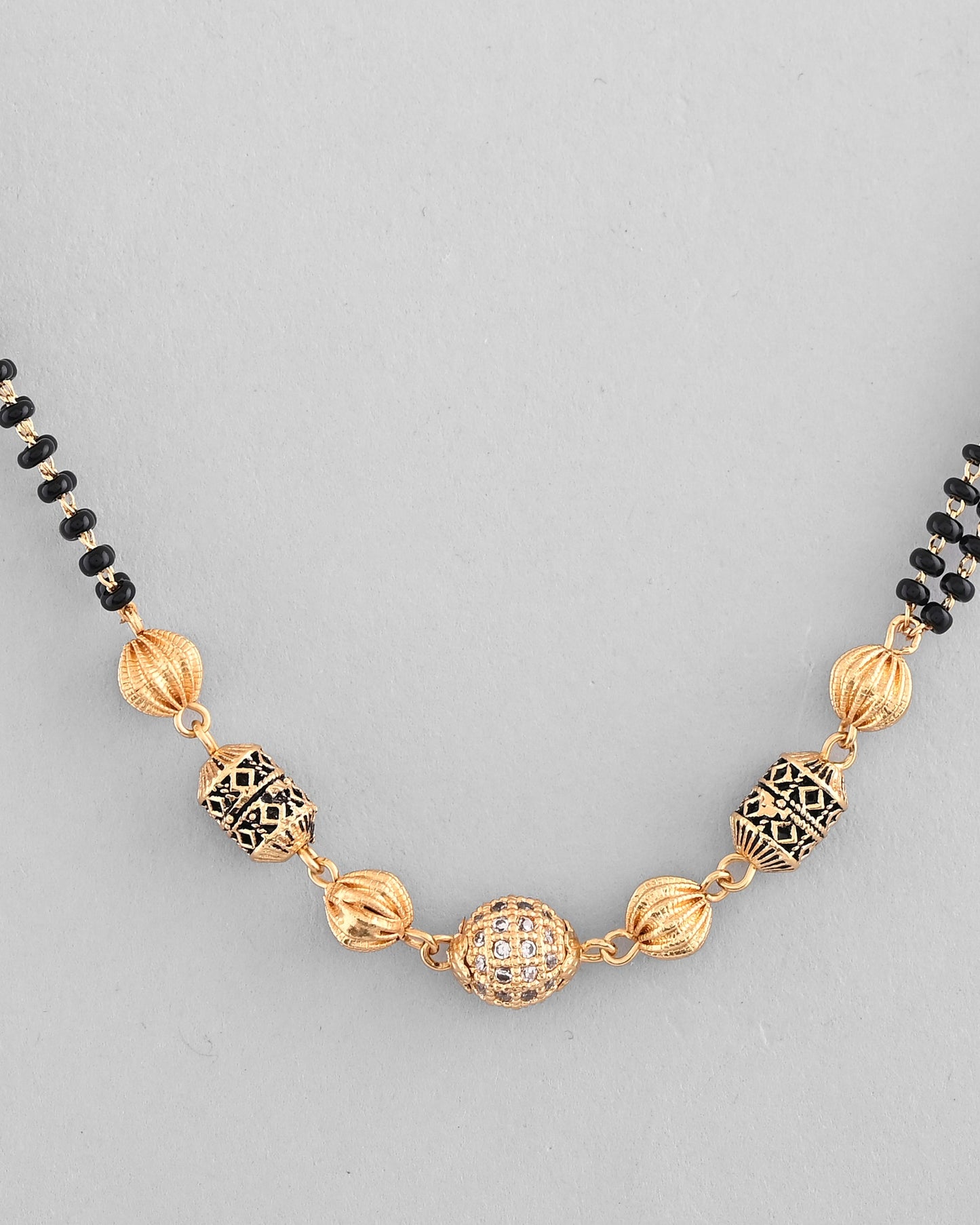 VOJ Gold-Polished Stone Studded Cricular shaped Mangalsutra - Swadesiicart
