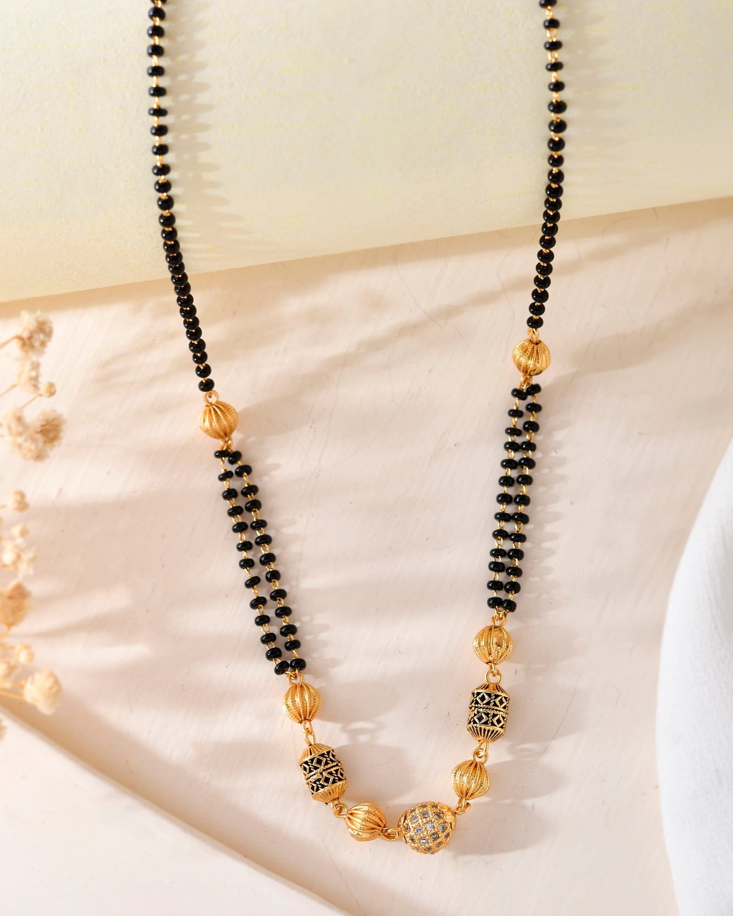 VOJ Gold-Polished Stone Studded Cricular shaped Mangalsutra - Swadesiicart