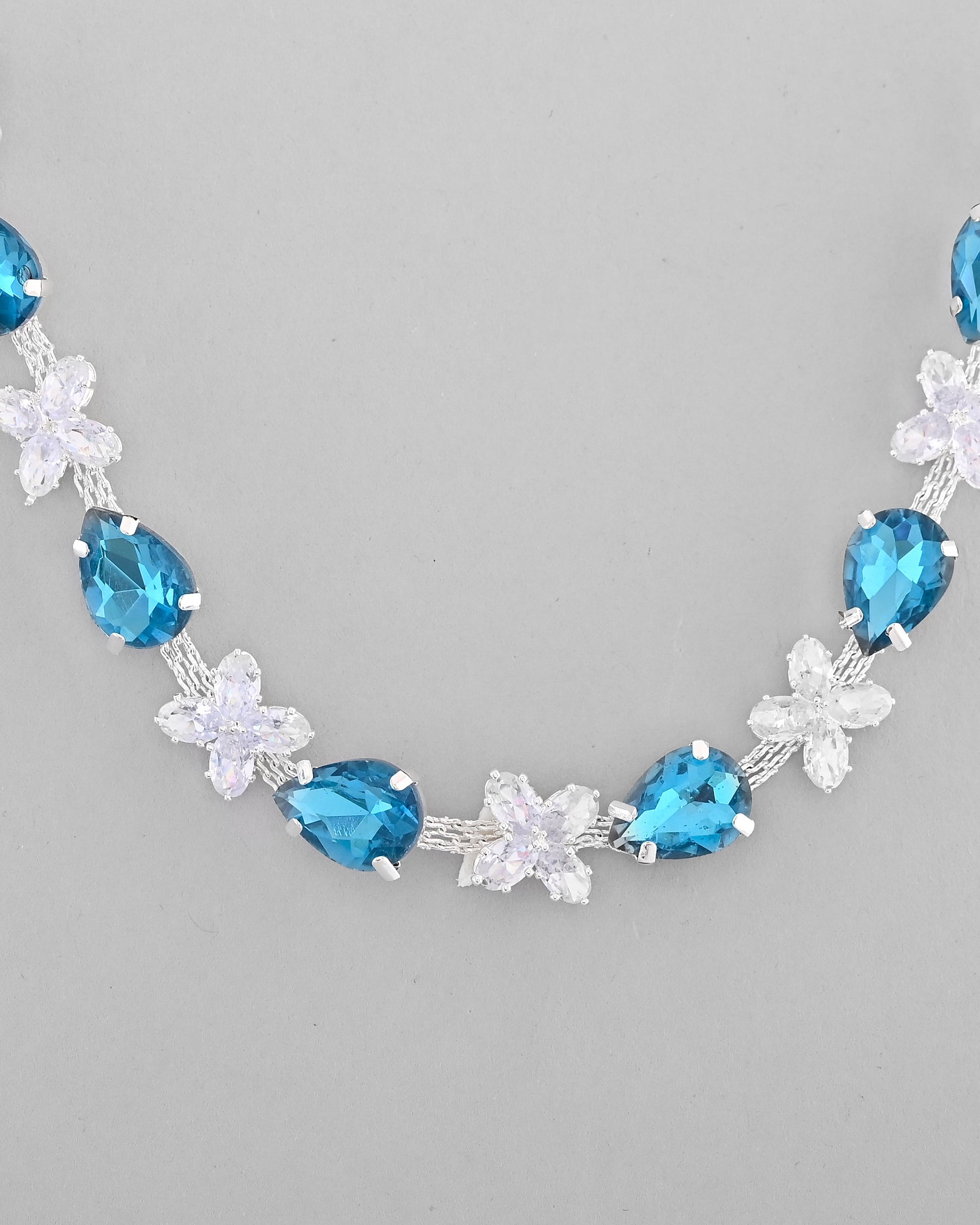 VOJ Silver Plated Blue And White Stone Studded Necklace with Earrings Set - Swadesiicart