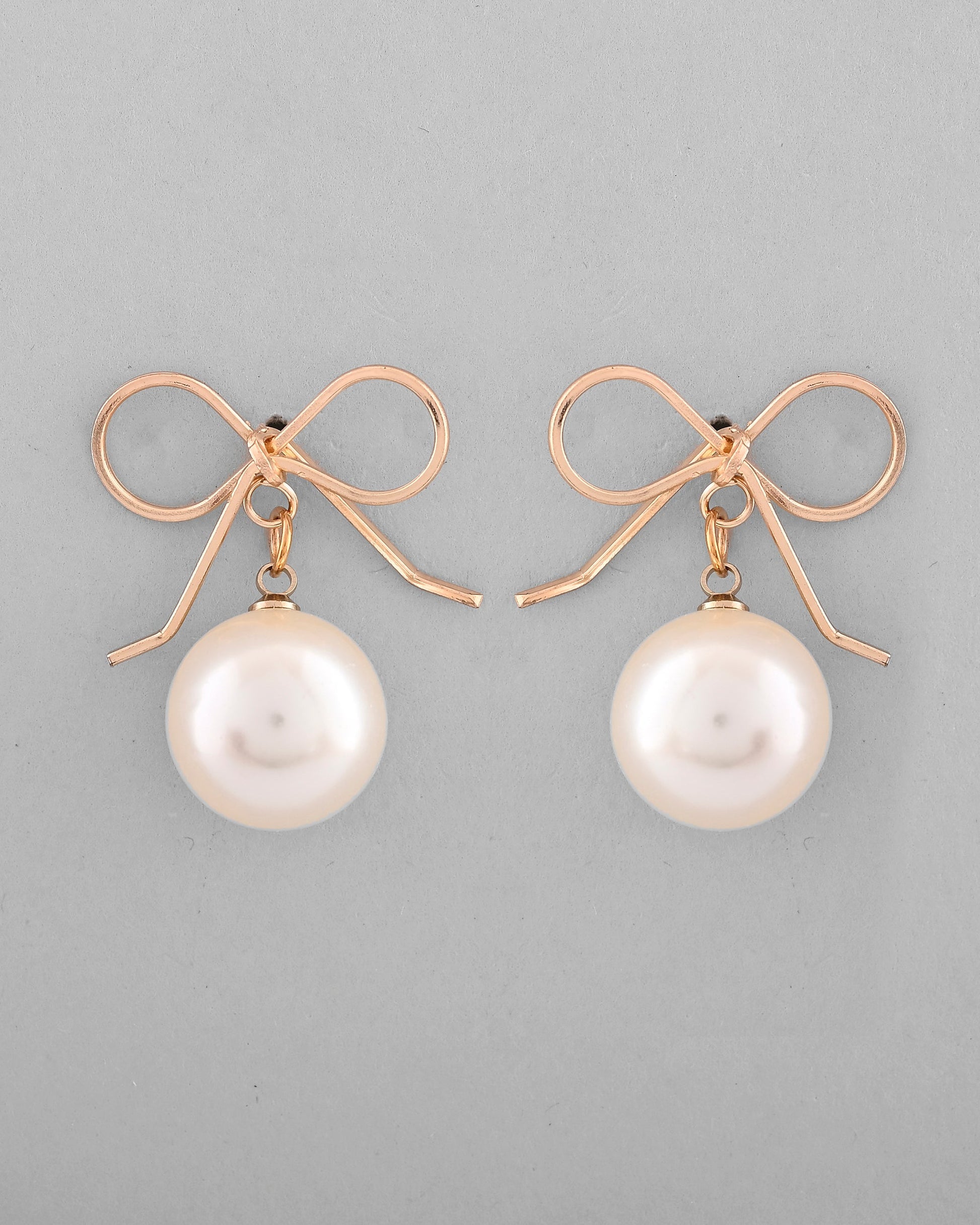 VOJ Gold-Polished Pearl & Bow Shaped Classic Drop Earrings - Swadesiicart