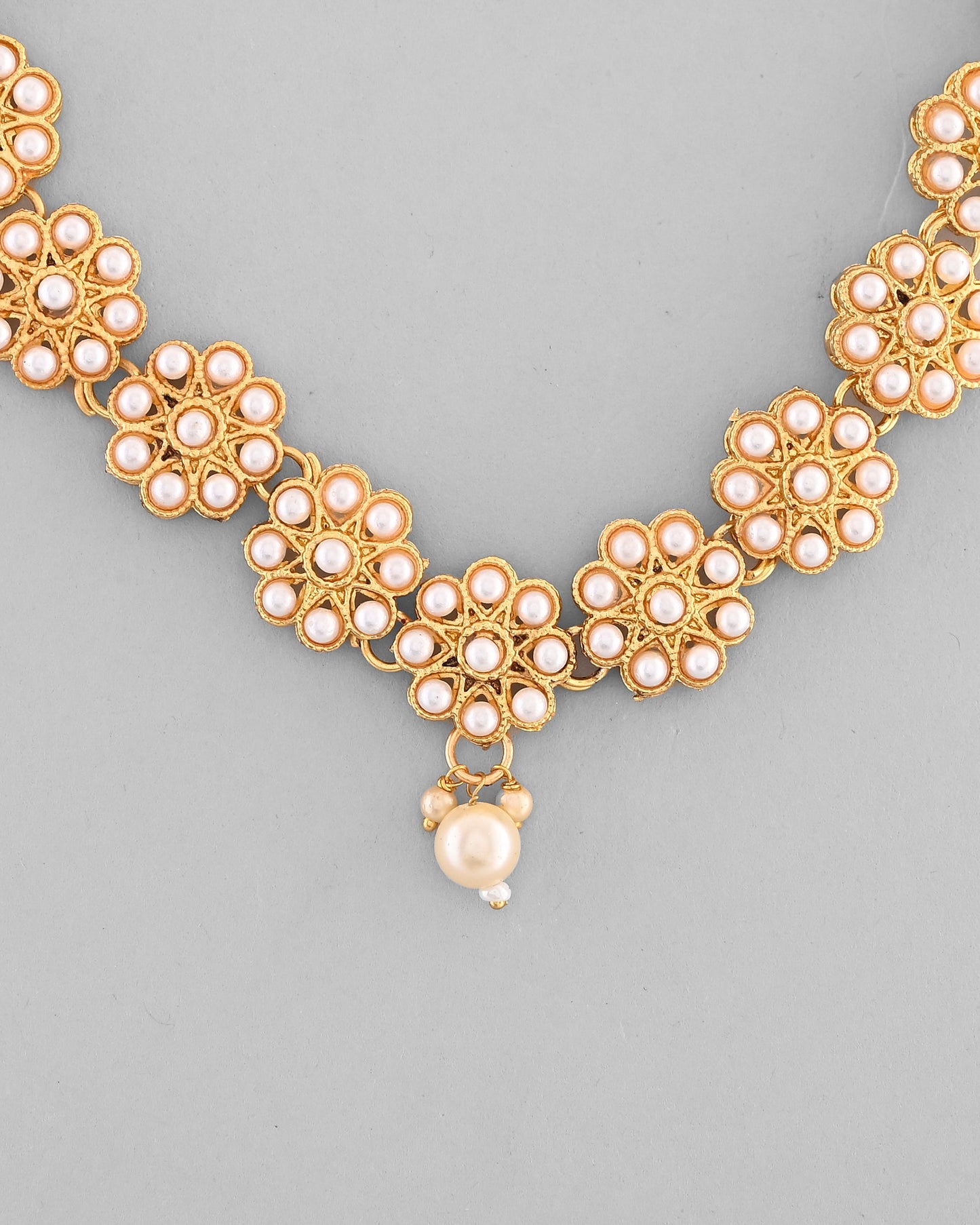 VOJ Gold-Polished Pearl Studded Floral Necklace And Earrings - Swadesiicart