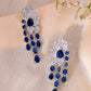 VOJ Silver Plated Ad And Blue Stone Studded Multi Layer Drop Earrings - Swadesiicart