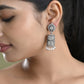 VOJ Silver Toned Stone Studded Jhumka Earrings - Swadesiicart