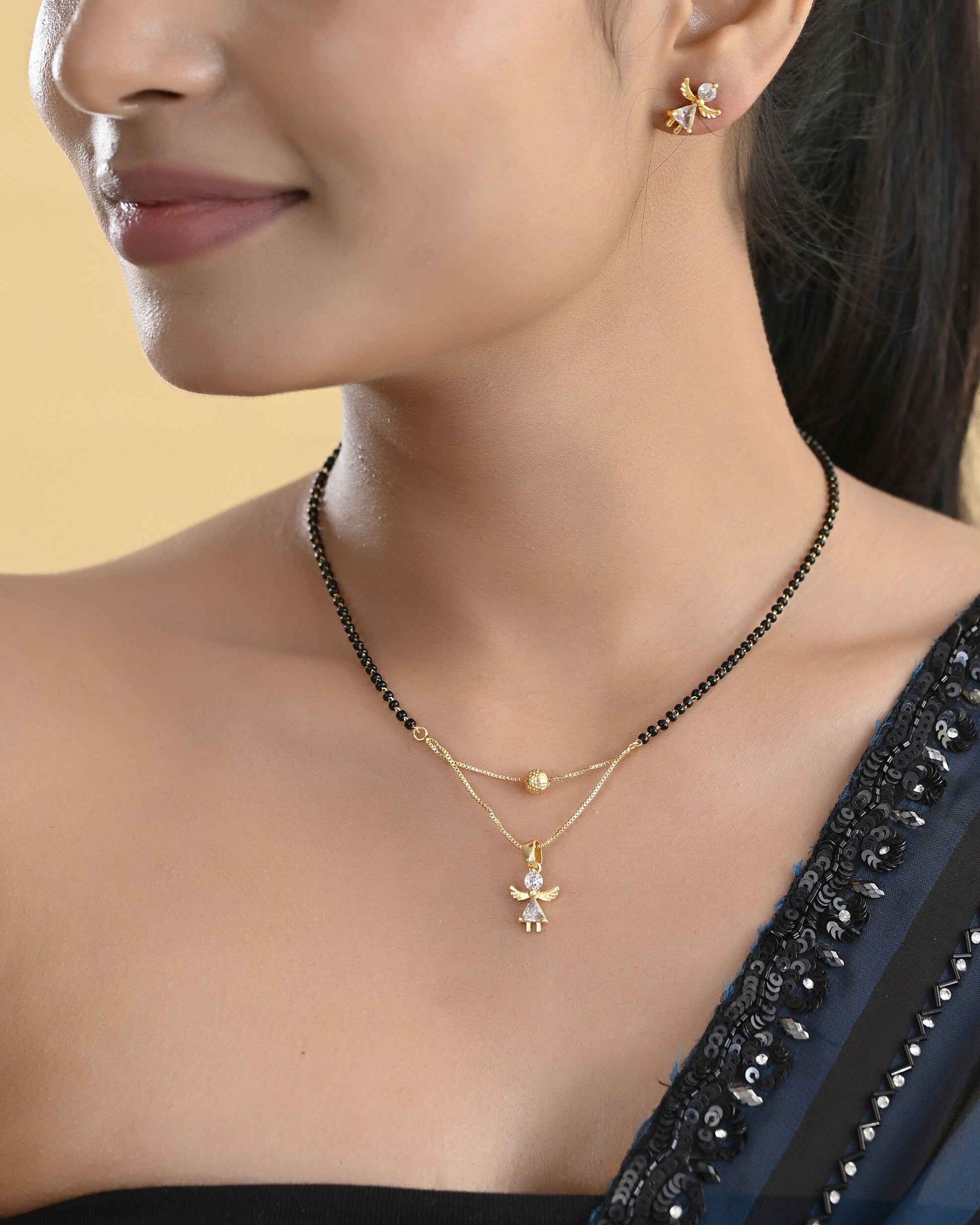 VOJ Gold-Polished Doll Shapped Stone Studded Mangalsutra With Earrings Set - Swadesiicart