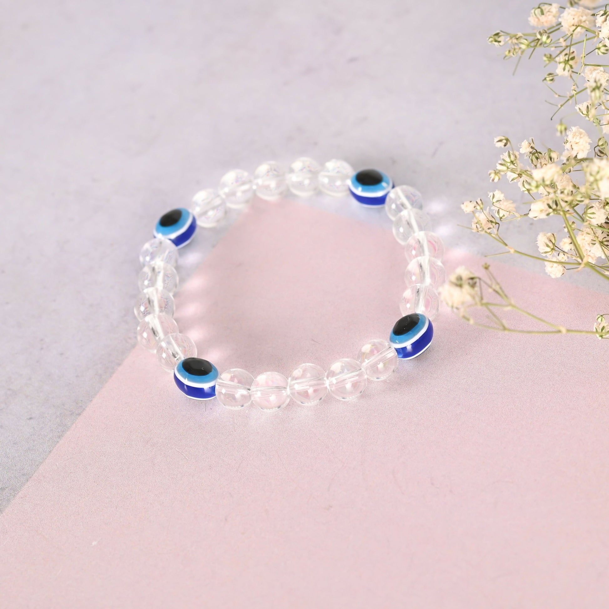 NVR Men & Women Evil Eyetransparent Beaded Elasticated Bracelet - Swadesiicart