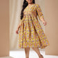 Janasya Gathered Cotton Mustard Floral V-Neck Dress | Swadesiicart
