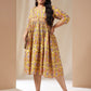 Janasya Gathered Cotton Mustard Floral V-Neck Dress | Swadesiicart