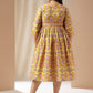 Janasya Gathered Cotton Mustard Floral V-Neck Dress | Swadesiicart