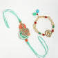 NVR Women & Men Set of 2 Multicolor Stone-Studded & Beaded Bhaiya Bhabhi Rakhi With Roli Chawal & Chocolate | Swadesiicart