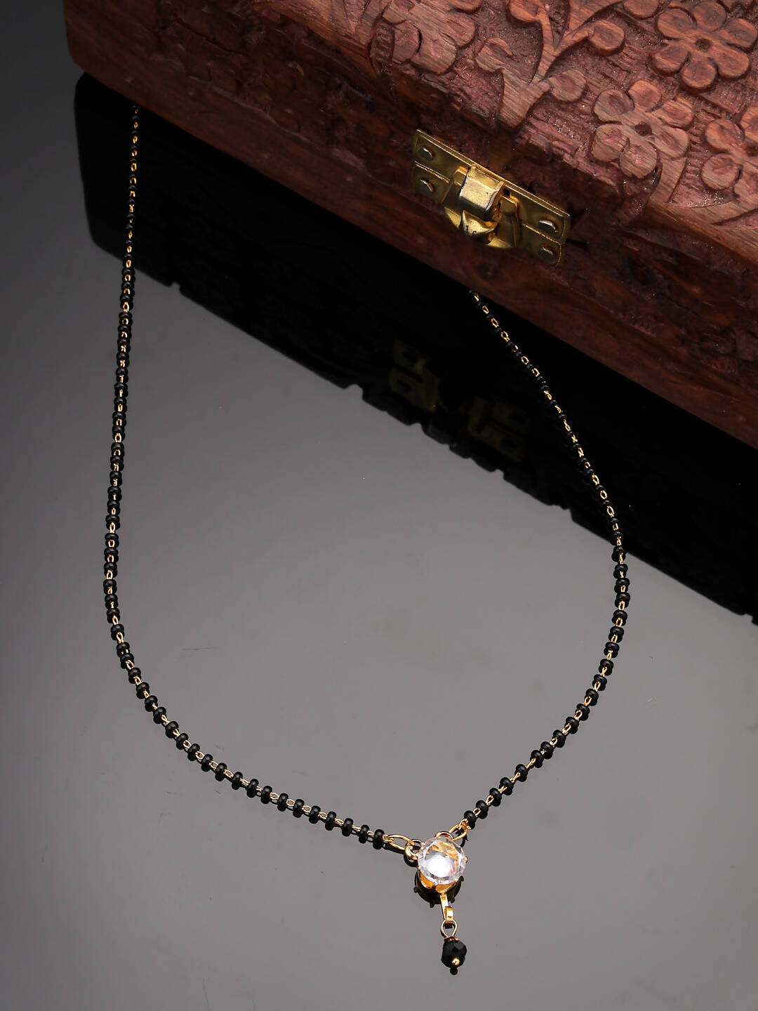NVR Women Ethnic Gold-Polished Beaded Mangalsutra With Ad Stone - Swadesiicart